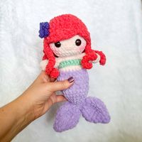 This free plush mermaid crochet pattern amigurumi pattern makes a squishy plush pal! This works up quickly with plush yarn.