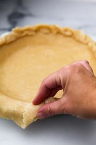 This is a super easy, no-fail, vegan pie crust recipe made with 5 simple ingredients you already have: flour, salt, baking soda, hot water, and oil.  No coconut oil or shortening, and no need to mess with ice water or keep your crust the right temperature.  This crust rolls out easily and bakes up flaky and delicious every time. #thehiddenveggies