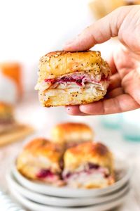 These Havarti Cranberry Turkey Sliders are a perfect game day choice or great for a casual dinner or lunch. Cheesy, cranberry and turkey in Hawaiian rolls with butter sauce are a hit for any day!!