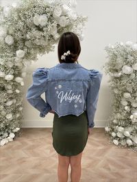 Add a touch of playfulness to your wardrobe with Juliet. She's flirty and cropped. The puff sleeves add a feminine flair, making this jacket perfect for any occasion where you want to stand out. The high-quality denim and versatile design ensure that this jacket will be a favorite for years to come. Featured with "Wifey" written on the back.