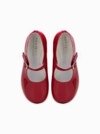 Get reacquainted with timeless deisgn this season with La Coqueta’s Patent Girl Mary Janes. Crafted from super-soft Nappa leather in a charming shade of patent red, your little girl will adore getting on the dancefloor with our eye-catching shoes. Fasten at the strap with an adjustable buckle, featuring a lightly padded footbed with a rubber sole for extra comfort. The perfect silhouette for party season, or adding a little attitude to your everyday wear, La Coqueta's Girl Mary Janes are the ult