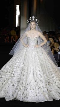 ZUHAIR MURAD on Instagram: "The ZUHAIR MURAD bride gracefully steps in a strapless gown adorned with gold and silver beads compelling a pearled ivory vision. ZUHAIR MURAD Fall-Winter 2022/23 Couture collection. See all the looks at zuhairmurad.com. #ZMCouture #ZMBride #LesArtsDivinatoires"