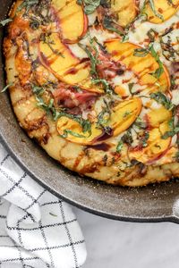 If summer had a pizza, this most definitely would be it. Start with your favourite pizza dough, slather on the fresh pesto as a base, and top with the delicious summery treats like basil, fresh peach slices and a yummy cheese blend!