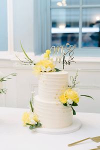 Yellow floral wedding cake. Earl gray and pina colada.