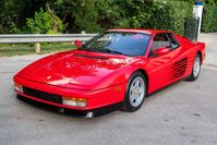 This 1990 Ferrari Testarossa is powered by a 4.9-liter flat-12 paired with a five-speed manual transaxle. Finished in Rosso Corsa over black Connolly leather, it has 16″ five-spoke wheels, air conditioning, and a Sony CD stereo. The car was registered in California until 2010 and spent time in Ohio and Indiana before it was acquired by the seller on BaT in September 2021. This Testarossa shows 94k miles and is offered with manufacturer’s literature, a clean Carfax report, and a clean Texas ti...