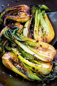 Learn how to cook bok choy, a healthy Asian vegetable, using the stir-fry method to create beautifully browned edges and crisp-tender stalks. #bokchoy #asiancuisine #stirfry