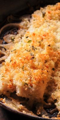 Lemon, white wine, herbs and a pinch of red pepper flakes come together to lend amazing flavor to this Boston Baked Cod. The fish is crusted with breadcrumbs and baked until crispy and flaky! #cod #seafod #fish #healthy #bakedfish