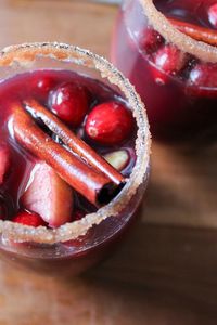 Cranberry apple sangria is the best sangria for Thanksgiving! It’s made with honeycrisp apples, apple juice, red wine and cranberry juice. It’s rimmed with cinnamon-sugar and it’s such a festive holiday drink! #sangria #thanksgiving #drink #cocktail #cranberry #apple