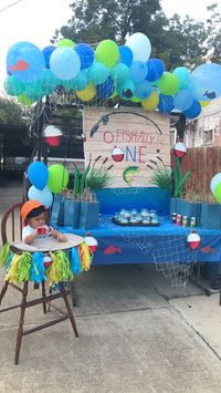 DIY Project, Literally Dollar Store Everything . I hand painted the sign on a dollar store table cloth, the fish are cutouts i drew on construction paper the bobbers are drawn and hand painted on foam boards