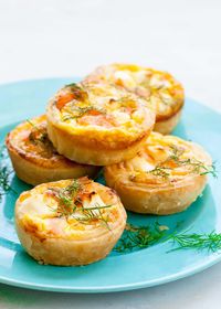 Super easy mini salmon quiches. Puff pastry crust. Salmon, cream cheese, and scallion filling. Make-ahead and freeze. Great party or brunch appetizer.