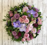 The softest, most elegant floral posy for a family tribute. 18” diameter. Made with chrysanthemums, roses, vanda orchids and sweet Williams with seasonal foliage’s. This is a gorgeous tribute for a garden / flower lover. The colours can easily be changed to suit the preferences of your loved one. #funeral #funeralposy #funeralflowers #sympathyflowers #beautyingoodbye