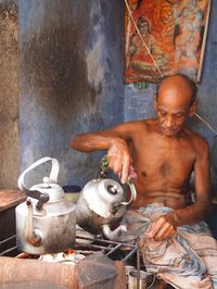 Tea seller in Shakari Bazar, Dhaka, Bangladesh