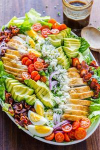 Easy Chicken Cobb Salad with the Best Cobb Salad Dressing! A protein-packed salad loaded with crisp lettuce, tomatoes, chicken, avocado and blue cheese. #cobbsalad #cobbsaladrecipe #easycobbsalad #bestcobbsalad #saladrecipes #salad #natashaskitchen