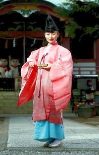 Tomoe Ilchino: Shinto Priest, Tokyo, Japan. "People believe being a priest is a man's profession, people don't know female Shinto priests exist. I decided to be proud of the fact I am a female priest and I began wearing a pink robe."| (REUTERS/Toru Hanai)