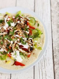 Our Slow Cooker Shawarma Chicken is perfect for summer - super simple to make and oh so tasty with fresh salad, yogurt dressing and warm flatbreads. Easy weeknight dinner - sorted! #slowcooker #slowcookerchicken #spicychicken #easydinnerreicpe #summerslowcookerrecipe #chickendinner