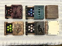 "Custom laser cut mini polyhedral dice boxes cut from premium Baltic Birch 1/8\" plywood. Covers and spines are dyed/painted to achieved a distressed colored look. Box comes with custom cut foam insert to hold a 7 piece set of miniature polyhedral dice. Box uses magnets to securely close. Box will also come with a random free set of Mini polyhedral dice! Dimensions: 2.25\" x 3\" x .9\" (These boxes are small) Dice dimensions: This dice are small!! See the third photo for comparison against a nor