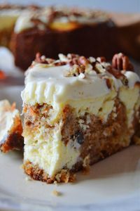 This Carrot Cake Cheesecake is the ultimate dessert mashup! It combines spiced, nutty carrot cake swirled into a cool and creamy cheesecake! The perfect dessert!