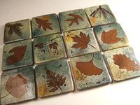 "Handmade in my Lititz Pa studio, these 6 inch tiles are made with a real leaf and cutting impressions. Developed for a\" Pennsylvania Woodland Theme\" installation at the Lititz Public Library, this style of decorating and glazing tile involves 25 different handling points with the clay from raw clay to finished fired tile. Great for accents in a backsplash or as a coaster, made with red stoneware clay. We will add bumpers to the back upon request for use as a coaster. If you buy 4 or more 6\"