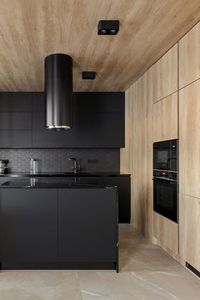 Matte Black Cabinets With Black Hexagon Backsplash Tiles