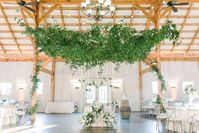 Floral Hanging Hoops and Greenery-Filled Centerpieces Took Center Stage at This Rustic-Chic Barn Wedding | Washingtonian (DC)