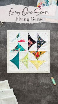 Flying Geese + Cathedral Windows = Quilt Magic! Looking to add a new dimension to your quilt projects? Try this fast and easy one-seam flying geese tutorial! This unique method not only simplifies the process but also brings a special flair to your creations. Featuring Bundle Up, the Floralism Edition & #AGFSparkleElements– a match made in heaven! #QuiltIdeas #SewingProjects #ArtGalleryFabrics #QuiltingInspiration #QuiltingFabric #LowVolumeFabrics #FabricCrafts #Hobby #QuiltBlock #QuiltingCotton