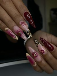 burgundy stiletto leopard/cheetah print nails with red flowers