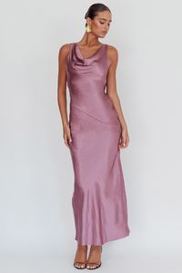 Satin maxi dress Cowl neck Backless with tie Invisible side zipper No lining You'll look like you just stepped straight off the red carpet in our gorgeous Cassiopeia dress. Featuring a cowl neckline and an open, draped back. It's perfect for a wedding or special birthday celebration. Team it with diamante heels and a clutch for a show stopping look. MODEL INFO Model is wearing size XS Height: 5'10" Bust: 36.0" Waist: 25.5" Hips: 33.0" CARE Hand Wash Cold. Do Not Iron. MATERIAL POLYESTER