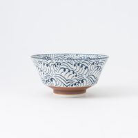 This regular-sized Japanese Ramen Bowl features a wave pattern in indigo blue. The simplified wave pattern is a design that is both modern and traditional and looks great in any table setting. The size and shape are perfect as a Ramen bowl and suitable for any kind of noodles such as Udon noodles and Soba noodles. It can also be used for a large portions of Donburi rice