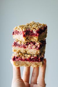 Raspberry Crumble Bars that are soft and thick and loaded with juicy raspberries. Essential summer dessert! #raspberrybars #dessert #raspberry #summerdessert | pinchofyum.com