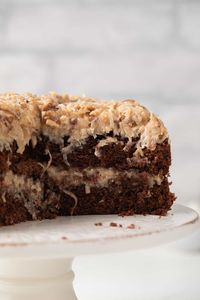 The best German Chocolate Cake features layers of moist chocolate cake topped with coconut pecan frosting. This cake is delightful!