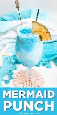 Cool off with an ocean blue Frozen Mermaid Rum Punch. A magical tropical drink recipe with lemonade, coconut, white rum and more! #mermaid #cocktail #livinglocurto #recipe #drinks