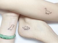 Tattoo uploaded by Tattoodo | Friendship Tattoos for 3 People by Playground Tat2 #PlaygroundTat2 #Playgroundtattoo #bestfriendtattoos #friendshiptattoos #friendtattoos #bfftattoo #matchingfriendtattoos #illustrative #linework #dinosaur #dino | 1181631 | Tattoodo