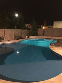 6' brown vinyl stone pool fence installed in Westbury, NY, by Liberty Fence & Railing.