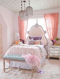 Anchor a palette of sweet pastels, like this room's medley of mint green, lavender, light blue, and pink, with a few dark touches. A deep purple pillow and curtain ties enrich the pale color scheme of this child's bedroom. /