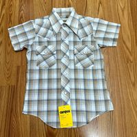 Size 7 Campus (Rugged Country) Plaid Western Shirt. Awesome Pearl Snap Buttons And Western Style Curved Yokes. White, Light Brown And Blue Plaid. Found This And Some Other Dead Stock Items At An Old Store On Beale Street About 20 Years Ago (It Was Vintage Then Too Lol). Hoped My Son Would Wear It But It Is Not His Style. New With Tags. Smoke/Pet Free Home. See All Pics For Measurements.