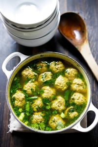 Arabic Meatball Soup with Spinach, Mint and Lime - with the most delicious broth ever! Make with this with turkey, lamb, beef or chicken. (Lamb is especially nice.) | #arabicsoup #meatballsoup #lamb www.feastingathome.com