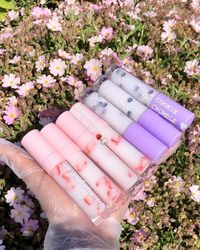 Our 8ml vegan clear gloss are silky smooth with high shine and packed with nourishing oils.  We hope that you will  love them as much as we do.  **ADD NOTE AT CHECKOUT FOR SCENT CHANGE** Scents Available😊 Vanilla💕 Floral💕 Chocolate💕 Bubblegum💕 Strawberry💕 Coconut💕 Peppermint💕 Marshmallow💕 Lemonade💕 Sherbet💕 Cranberry💕 Banana💕 Pistachio💕 Honey💕 Lavender💕 Mixed Berries💕 Caramel Mocha💕 Pink Starburst💕