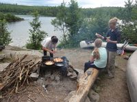 Three first time campers hire a guide to learn life skills: carrying  paddling canoes, setting up tents, cooking tasty meals (and desserts!), playing games and relaxing.  "Into the Wilderness,"  Courtesy of Minnesota Women's Press.