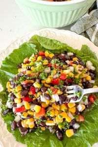 Quick and easy black bean salad with corn made with just a few pantry ingredients in 10 minutes with a flavorful lime vinaigrette.