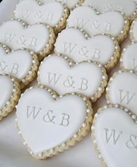 Make your special day unforgettable with some custom iced heart biscuits, featuring the bride and groom’s initials. Share the love with your wedding guests through these delightful wedding favours 🤍✨ #WeddingFavours #PersonalisedWedding #BridalBoutique #HeartBiscuits