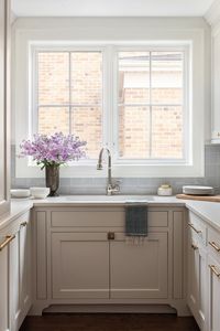 Tile by Ann Sacks; hardware by Top Knobs. Design by Centered by Design #benjaminmoore #kitchencabinets #brutonwhite