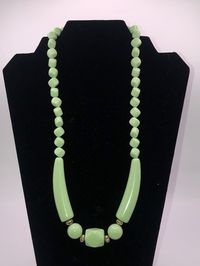 "Vintage mid century faux green jadeite beaded necklace. 23\" long. Spring ring clasp. Excellent condition with no chips, cracks or stains. Belonged to a family member. Smoke free home. Thanks!!"