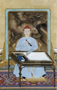 Kangxi Emperor in Informal Dress Holding a Brush. circa 1700 The Palace Museum Beijing. China.