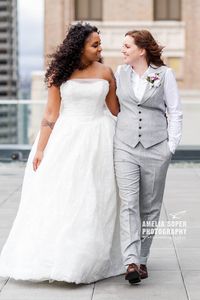 Grey women's wedding suit with vest same-sex lesbian wedding Seattle Thompson hotel.