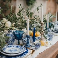 Mediterranean wedding - A wedding with decor inspired by the Mediterranean region, like olive branches, bright blue accents, and al fresco dining