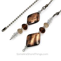 "Ceiling fan and light pull chain set with copper beads, brown and tan glass faceted beads, and clear glass spacer beads. I can create any ceiling fan pull to match your interior. Please select \"request a custom order\" to contact me. Beaded length is 2-1/2 inches. Also includes 7 inch pull chain and connector. Your item will arrive in a gift box ready for gift giving and be shipped USPS First-Class Package."