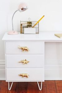 Attach bolts to the back of small toys and spray paint them to create fun drawer pulls.