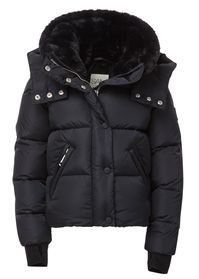 This quilted, down puffer jacket is crafted from a densely woven nylon. It is lightweight, yet protective from wind and water, and filled with down to achieve warmth and an ultra soft feel. The Lara features both a faux fur stand collar and detachable hood, fleece wrist cuffs with thumbholes, a center front zip and snap placket closure, and lower zip pockets.