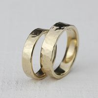 Wedding Ring Set. Hammered solid 14k gold wedding ring set shown in 14k yellow gold. This listing is for the set that has 1 wide band and 1 narrow band. The wider ring measures about 5mm high and 1.5m