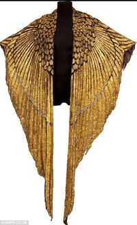 The Golden Cape from the 1963 film Cleopatra. Worn by Liz Taylor, the leather & gold garment is designed to look like the wings of a Phoenix.